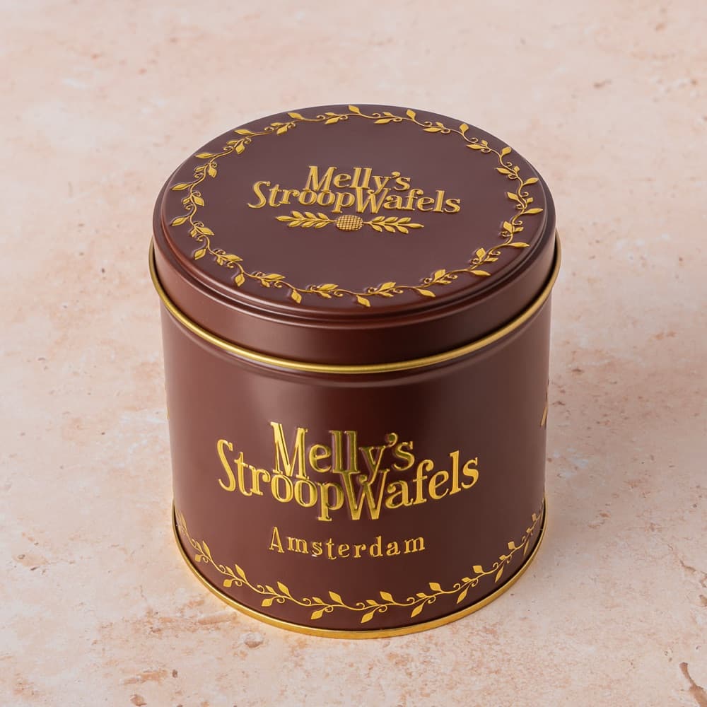 A brown Melly's stroopwafel tin used to keep stroopwafels fresh